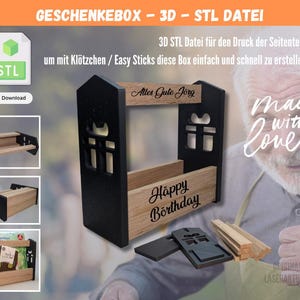 Pode incluir: Uma caixa de presente de madeira com moldura preta e painéis castanhos claros. A caixa tem desenhos de janelas recortadas e as palavras "Happy Birthday" e "Alles Gute Jörg" estão gravadas na madeira. A imagem também inclui o texto "GESCHENKEBOX - 3D - STL DATEI".