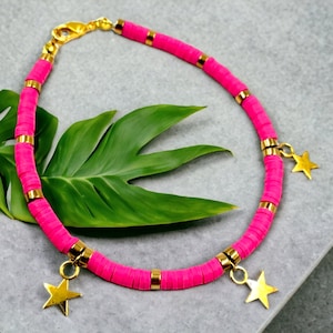 fushia pink heishi disc bracelet with golden accents & gold star charms
