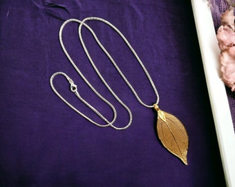 sterling silver chain with beautiful contrasting filigree golden leaf pendant