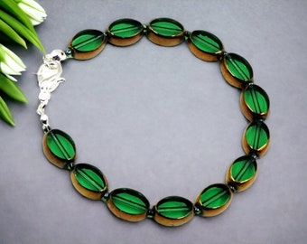 vibrant green glass bracelet framed in antique gold