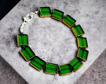 vibrant green glass bracelet edged in antique gold