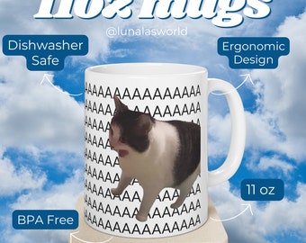 May include: White ceramic mug with a black and white cat image. The mug has a black repeating pattern of the letter 'A' on the side. The mug is 11 ounces and has an ergonomic design. It is dishwasher safe and BPA free.