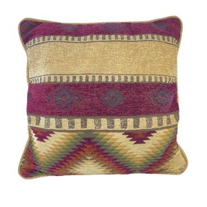 May include: A decorative throw pillow with a southwestern pattern in shades of burgundy, gold, green, and brown. The pillow has a geometric design with stripes and diamond shapes.