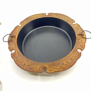 vintage japanese cast iron pan with ornate floral embossing & handles