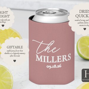 May include: A dusky pink can cooler with the text "The Millers" and the date 09.18.26 in white script. The cooler is around a silver can, with lemon and lime slices in the background.