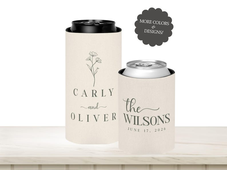 May include: Two beige can coolers with black rims. One cooler has the names "Carly and Oliver" with a floral design. The other cooler has the text "the Wilsons" and the date "June 17, 2020". A dark grey circle with text is in the background.