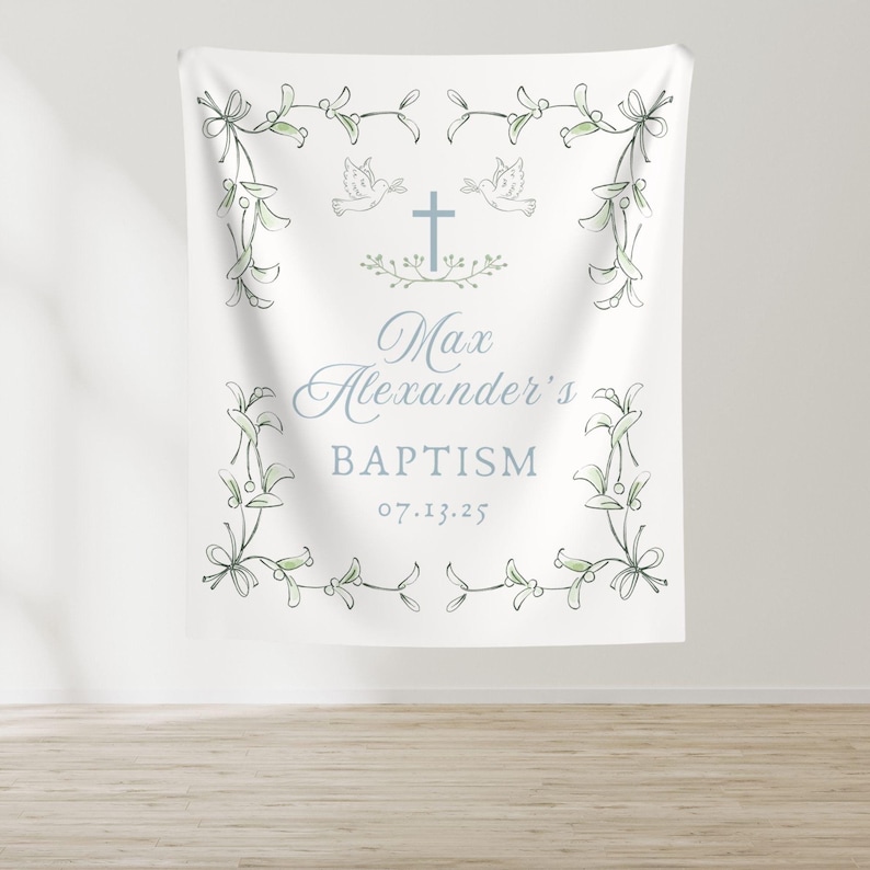 May include: White baptism banner with a green leafy border, two white doves, a cross, and the text "Max Alexander's Baptism 07.13.25"