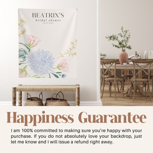 May include: A white backdrop with a floral design in shades of blue, pink, and green. The text "BEATRIX'S bridal shower 06.17.20XX" is at the top of the backdrop. The text "Happiness Guarantee" is at the bottom of the backdrop. The text below the guarantee reads "I am 100% committed to making sure you're happy with your purchase. If you do not absolutely love your backdrop, just let me know and I will issue a refund right away."