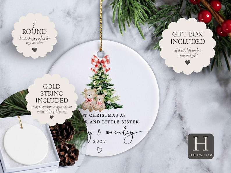 May include: A white ceramic Christmas ornament, 3 inches in diameter, with a gold string. It features a Christmas tree design with teddy bears and the text "First Christmas as Sister and Little Sister" with a name and the year 2025.