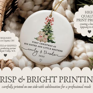 May include: A white ceramic Christmas ornament with a gold string, featuring a Christmas tree, teddy bears, and the text "First Christmas as Big Sister and Little Brother." The ornament is personalized with names and the year 2025.
