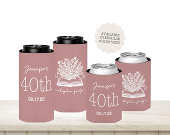 May include: Dusty rose-colored can coolers with white text and floral designs. The text reads "Jennifer's 40th" and "09.17.25". Some coolers feature an open book with flowers. Available in regular and slim sizes.