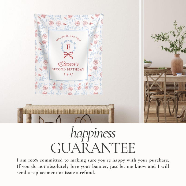 May include: A personalized banner with a floral pattern in red and blue, featuring the text "RED, WHITE, AND TWO!" and "Eleanor's SECOND BIRTHDAY 7-4-25". The banner is displayed above a wooden bench.