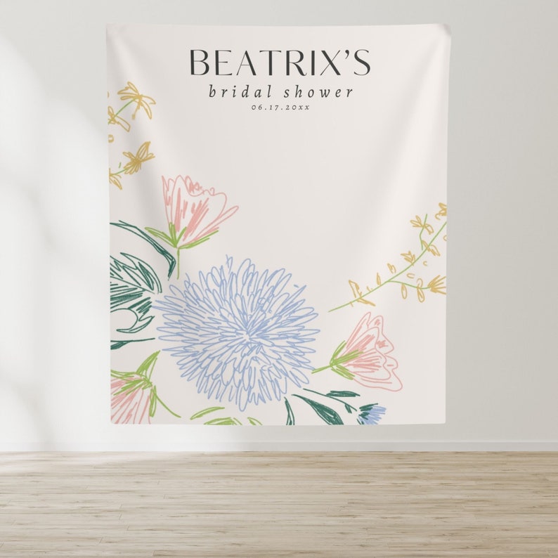 May include: A white backdrop with the text "BEATRIX'S bridal shower 06.17.20XX" in black. The background is decorated with a floral design in shades of blue, pink, and yellow.