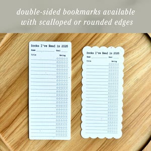 May include: Two white double-sided bookmarks with the text "Books I've Read in 2026". One bookmark has a rectangular shape, and the other has a scalloped edge. Both have lines for title, name, goal, and rating.