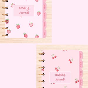 May include: Pink reading journal with a spiral binding and a strawberry pattern. The cover features the text "Reading Journal" in a white box. The journal has labeled tabs for Library, Ratings, Series, Reviews, Movies, and TBR.