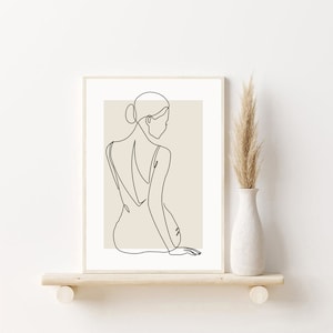 May include: A line drawing of a person sitting with their back to the viewer, wearing a simple dress. The drawing is in black on a beige background.