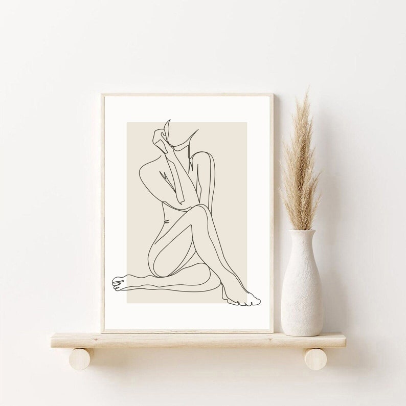 May include: A line drawing of a person sitting with their legs crossed, rendered in black on a beige background.