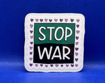 May include: A square sticker with a scalloped white border featuring a pattern of small purple hearts. The center is divided into a green top half and a black bottom half, with the white text STOP WAR printed across the two sections.