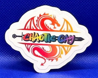 May include: A die-cut sticker featuring a stylized dragon silhouette in a red-to-yellow gradient. A black sword graphic runs horizontally through the center, overlaid with the rainbow-colored text "CHAOTIC GAY" in a bold, sans-serif font.