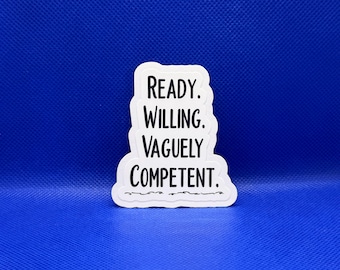 May include: A white die-cut sticker with a black border and black text that reads Ready. Willing. Vaguely Competent. with a decorative wavy line underneath the text. The sticker has a smooth, matte finish and a distinct, irregular shape.
