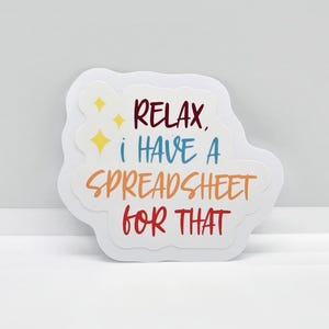 May include: White sticker with a rainbow-colored text that reads "Relax, I have a spreadsheet for that".