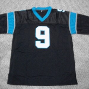 May include: Black football jersey with blue and gray trim. The number 9 is printed in white on the front of the jersey.
