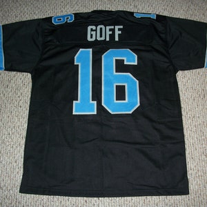 May include: Black football jersey with blue and white stripes on the sleeves. The jersey has the number "16" and the name "GOFF" on the back.