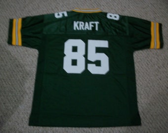 Camiseta personalizada cosida Tucker Kraft #85, color verde bahía. Todas las tallas para adultos.