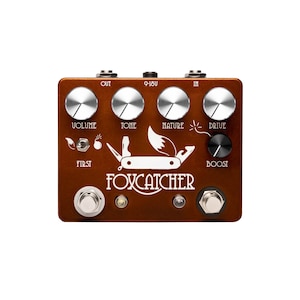 May include: A brown guitar effects pedal with silver knobs and the text "FOX CATCHER". The pedal has controls for volume, tone, nature, and drive, with a boost function. A white graphic of a fox and a pocket knife is featured.
