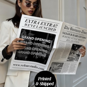 May include: A person holding a newspaper with the headline "EXTRA EXTRA!! WE'VE LAUNCHED" and "GRAND OPENING" text. The newspaper also features "The Business Times" and "VELOUR HAIR STUDIO". The image includes the text "Printed & Shipped".