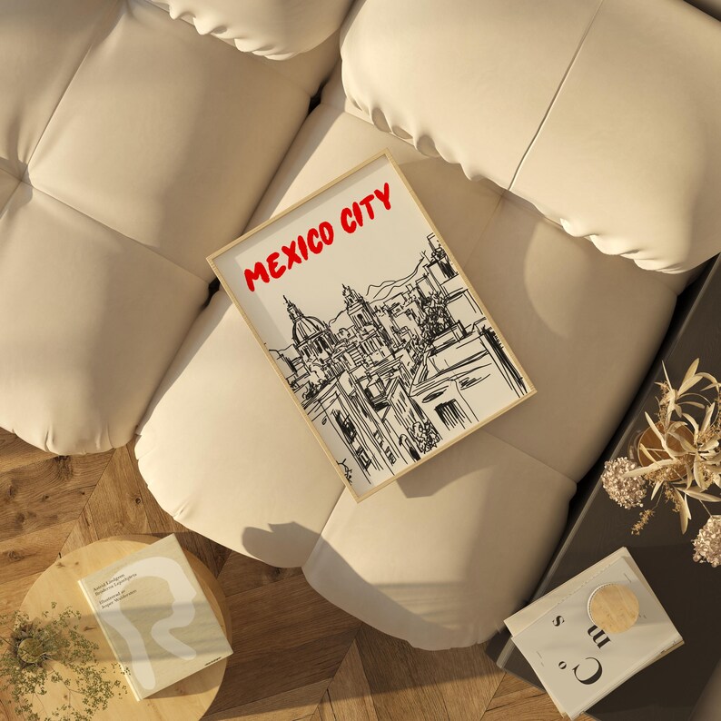 May include: A framed black and white line drawing of the Mexico City skyline with the text "MEXICO CITY" in red letters at the top of the frame.