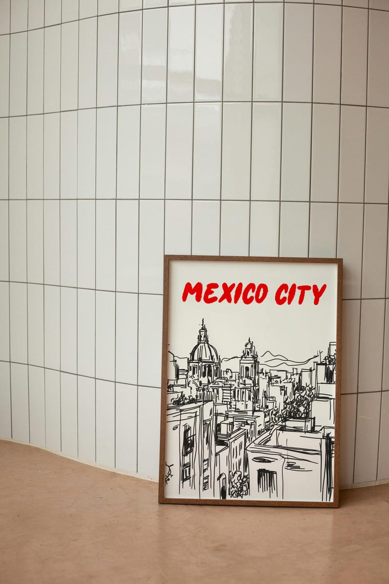 May include: A framed black and white line drawing of the Mexico City skyline with the text "MEXICO CITY" in red letters at the top of the frame.