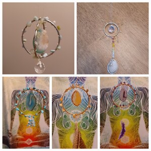 May include: A set of four crystal and wire dreamcatchers. The dreamcatchers are made with different coloured crystals and wire. The dreamcatchers are hanging from a string.