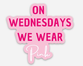 May include: Pink sticker with the text "On Wednesdays We Wear Pink" in white lettering on a pink background.