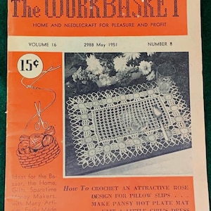 May include: Vintage "The Workbasket" magazine cover from May 1951, featuring needlecraft projects. The cover is orange and green, with the magazine title in large, bold letters. Includes a crochet pattern for pillow slips and a hot plate mat.