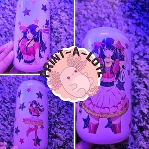 May include: Three white ceramic tumblers with different anime girl designs. The designs feature black hair, pink and red clothing, and stars. The tumblers are printed with the text "Print-A-Lot".