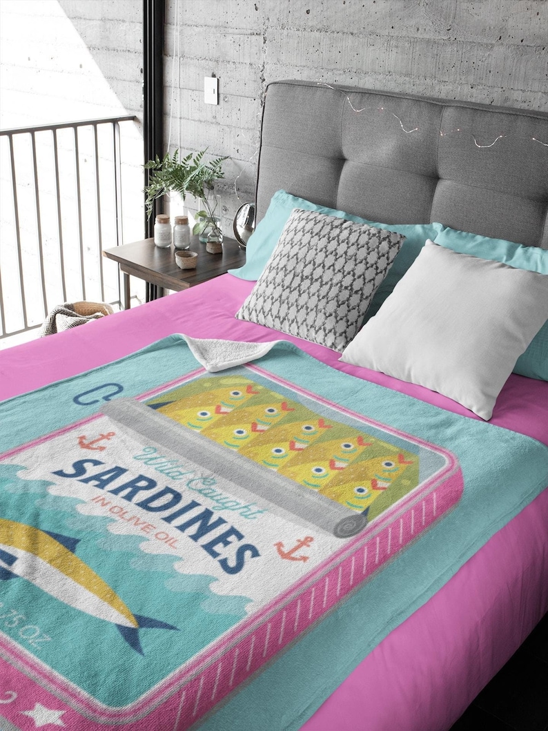 Sardines art print on a plush blanket.