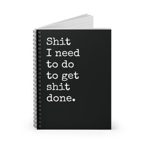 May include: Black spiral bound notebook with the text "Shit I need to do to get shit done." printed in white.