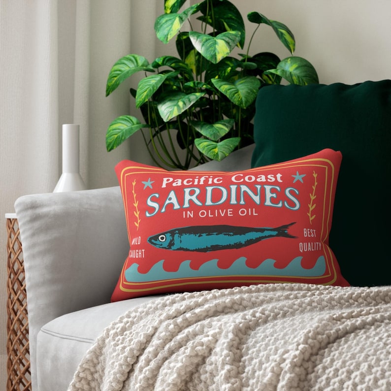 Sardines art print on a lumbar pillow in bright colors. Designed by Phrase Fair.
