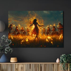 May include: A canvas print showing a ritual scene. A central figure in a red dress dances amidst flames, surrounded by drummers and figures holding torches. The artwork is set against a dark background with a fiery, golden glow, creating a dramatic effect.