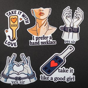 May include: A collection of stickers with various designs and text. One sticker features a paddle with a heart and the words "Take it with Love." Other stickers include phrases like "I prefer a hand necklace" and "yes sir."