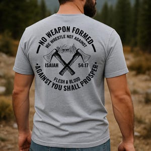 No Weapon Formed Isaiah 54 17 Christian T-Shirt – Men’s Faith-Based Outdoor Tee, Back Print Axes & Mountains, Flesh and Blood Shirt