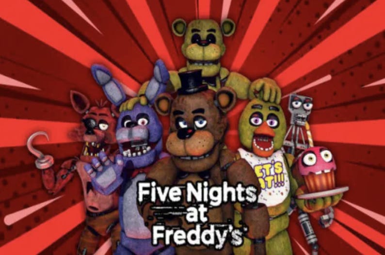 Peut inclure: Les personnages de Five Nights at Freddy's, dont Freddy Fazbear, Bonnie le Lapin, Chica la Poule, Foxy le Renard Pirate et Golden Freddy, sont repr&eacute;sent&eacute;s dans un style cartoon color&eacute; sur un fond rouge et blanc.