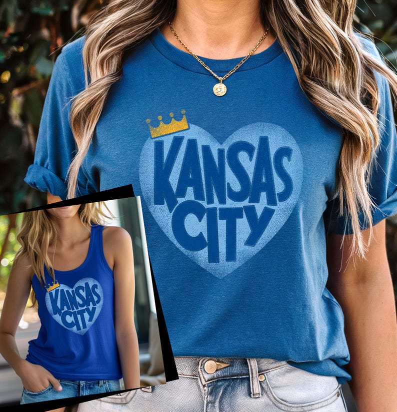 May include: A blue t-shirt with a blue heart graphic that says "Kansas City" in white letters. A gold crown sits above the heart.