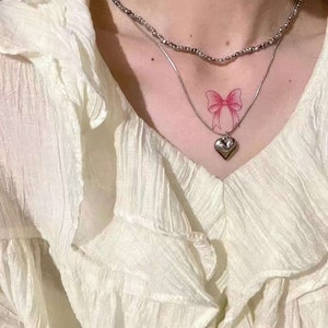 Pegatinas de tatuaje de arte de dibujos animados de lazo rosa