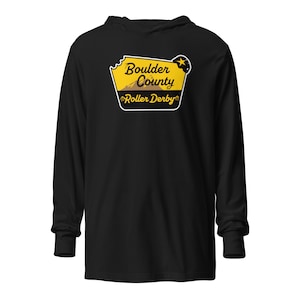 May include: Black long-sleeve hooded shirt featuring a yellow and black graphic. The graphic includes the text "Boulder County Roller Derby" with a mountain and star design. The shirt has a hood and long sleeves.