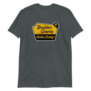 May include: A dark heather grey t-shirt with a yellow and black graphic of a sign that says "Boulder County Roller Derby".
