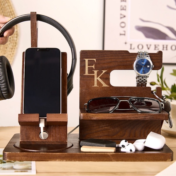 May include: Wooden organizer with compartments for a phone, watch, sunglasses, and headphones. The organizer has the initials "E.K." engraved on the front.