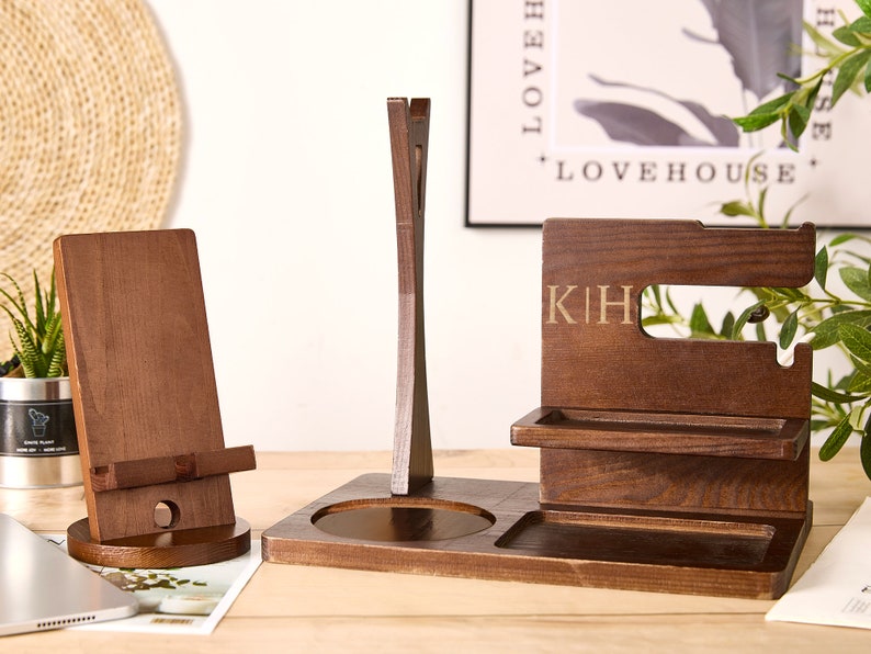 May include: Wooden desktop organizer with a phone stand, watch holder, and a tray for rings or other small items. The organizer is engraved with the initials "KIH".