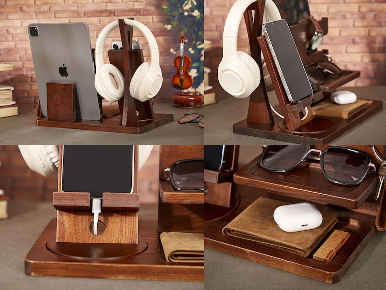 May include: A wooden organizer with multiple compartments for storing various items, including a phone, headphones, glasses, and a watch. The organizer has a brown finish and is made of wood.